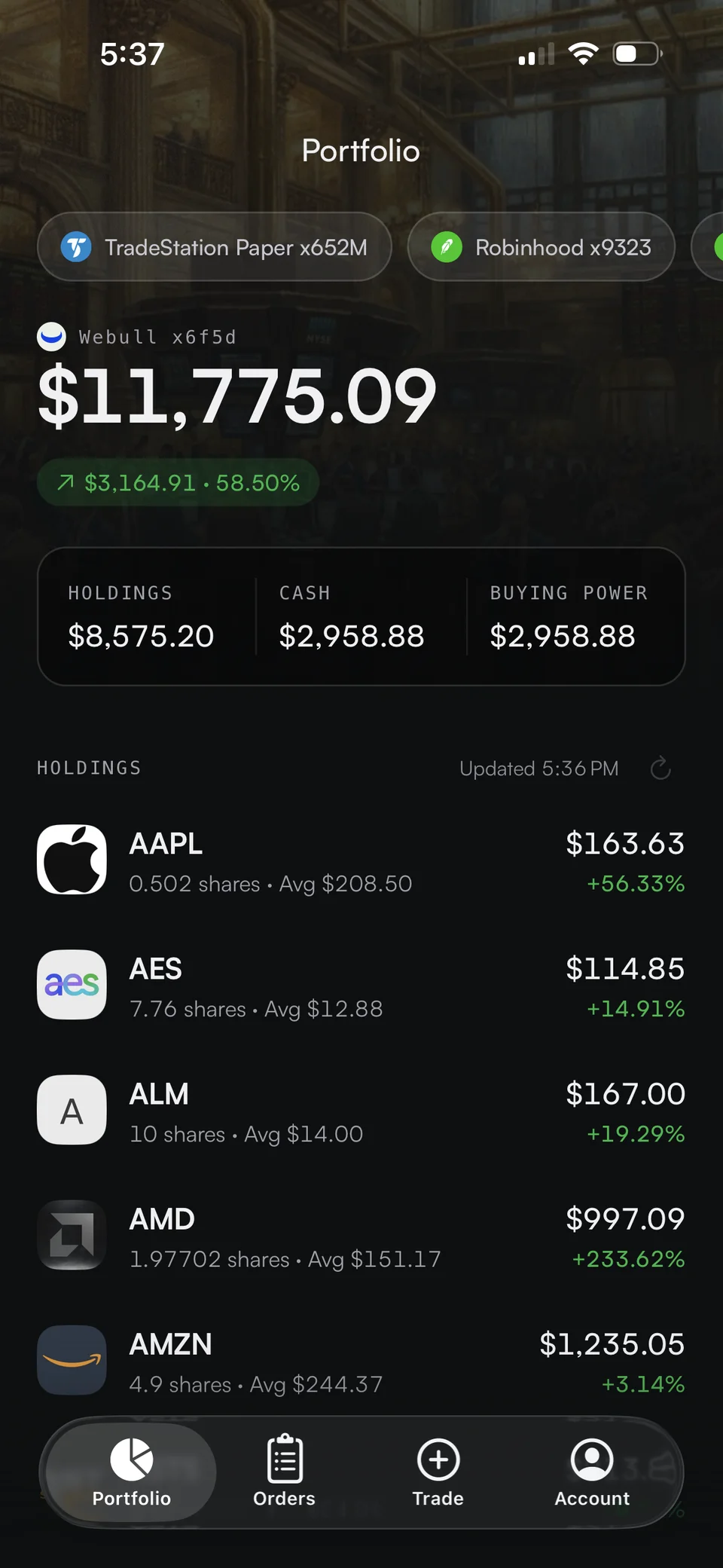 Trade It for iPhone showing connected brokerage accounts and holdings